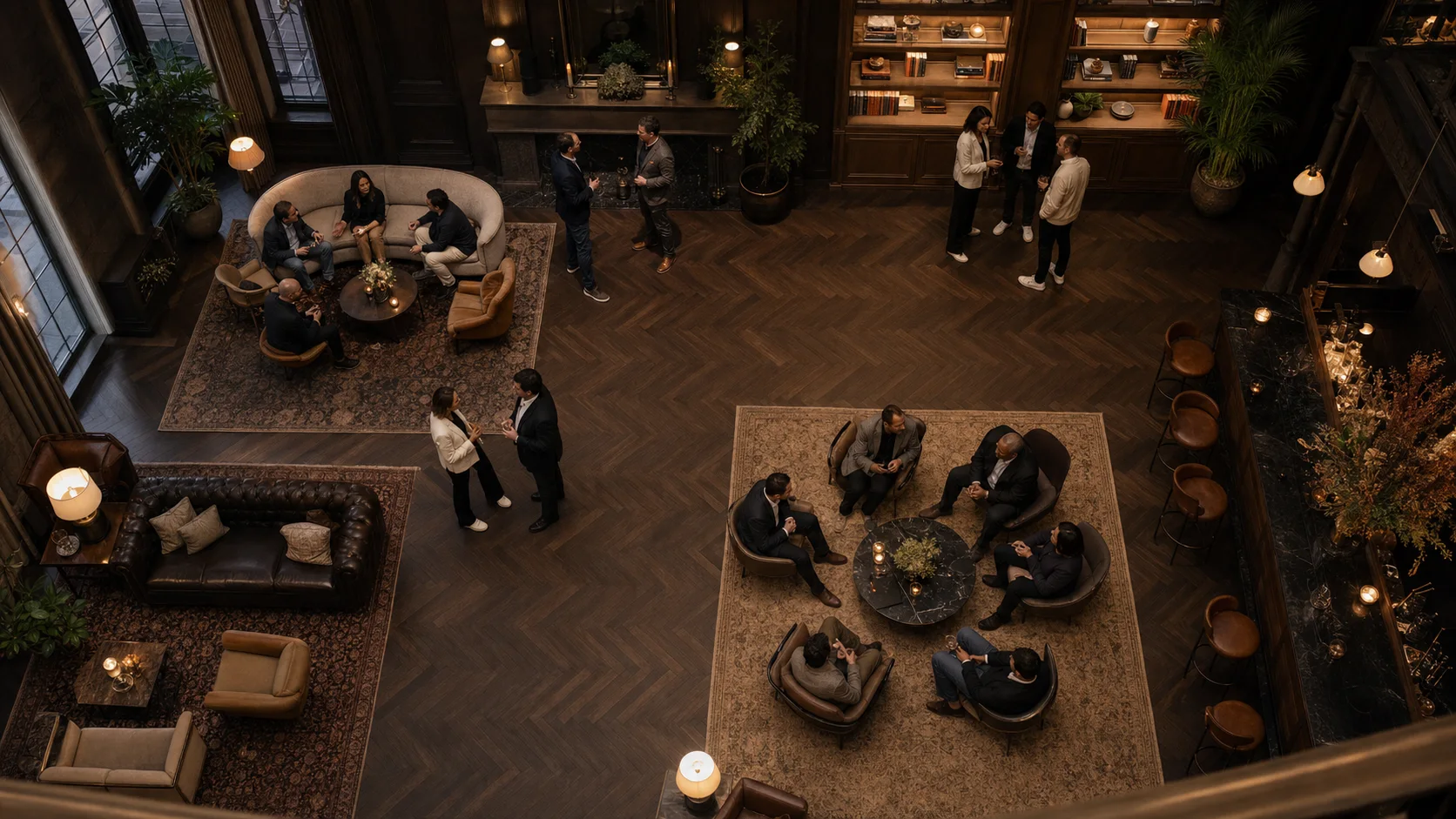 Bird's-eye editorial view of founders and operators connecting across several small-group conversations